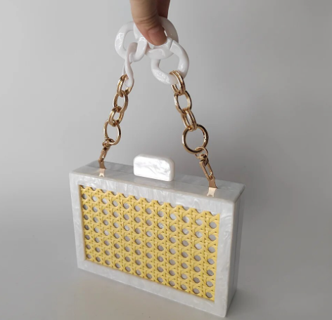 White acrylic box clutch with choice of wrist or shoulder straps.