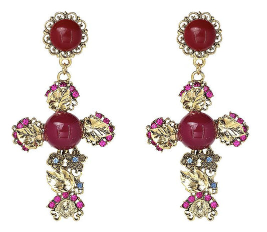 gold coloured dainty leaf cross with resin studs with pink and blue embellishments