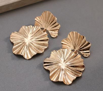 A gold pressed metal leaf design. The perfect go-to for an outfit when you're not sure what earrings to wear. 