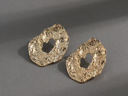 geometric irregular drop stud design, perfect for day or night looks.