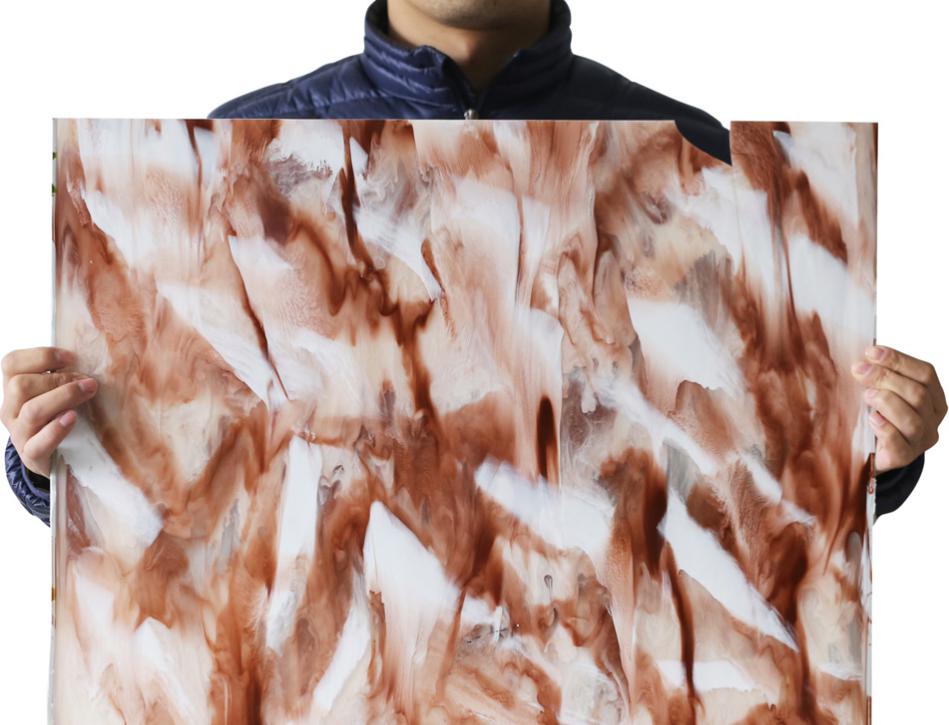 A three piece design made from marbled acrylic board in a golden coloured frame and bordered by tiny cubic zirconias. Each earring is cut from a single piece of acrylic board, meaning each earring is unique and different. Like you.