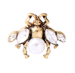 A small and intricate bug stud earring in vintage gold, faux pearl and clear crystals. The detailing on the little bug is just gorgeous.