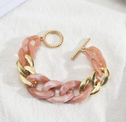 These fun geometric acrylic link chain bracelets with gold colour toggle clasp are sure to be a conversation starter.