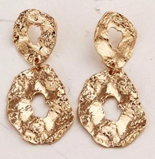 A pressed gold/silver abstract oval design. Lightweight. Versatile. Statement.