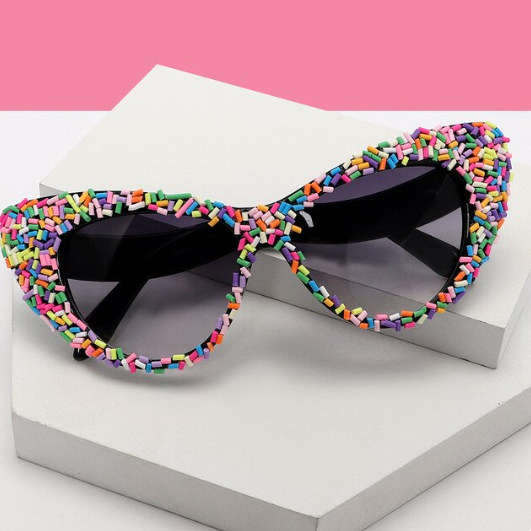 Black Frame Sprinkle Sunglasses! Each pair comes with an Entire Me carry case, plus they offer UV400 protection and a curved nose-piece for an ultra-comfy fit.