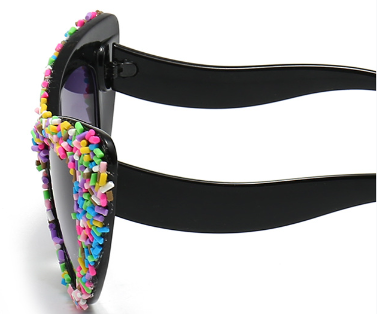 Black Frame Sprinkle Sunglasses! Each pair comes with an Entire Me carry case, plus they offer UV400 protection and a curved nose-piece for an ultra-comfy fit.