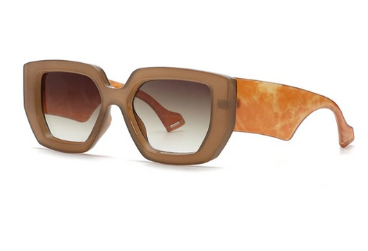 bold and fashionable oversized frame in a Brown hue, these statement sunglasses offer UV400 protection and come with a complimentary Entire Me carry case.