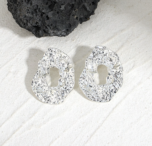 geometric irregular drop stud design, perfect for day or night looks.