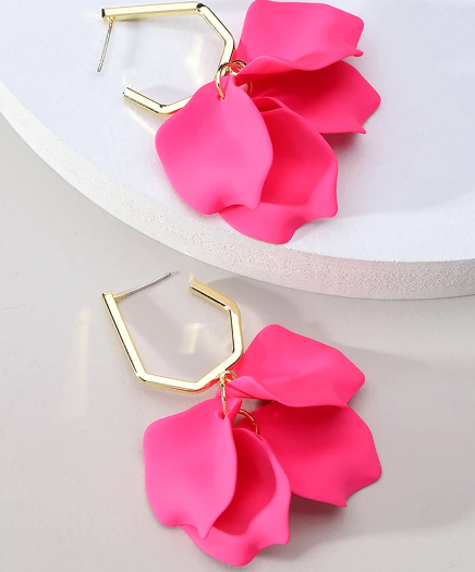 Crafted from acrylic and fastened with a secure stud backing, these chic hot pink petal flowers are a statement on their own.