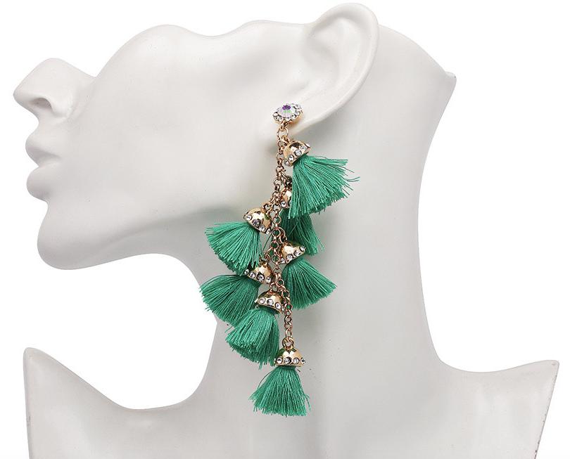 A multi layered busy tassel drop in bright bold colouring, complimented by gold and diamonte clasping. Bright and fun!