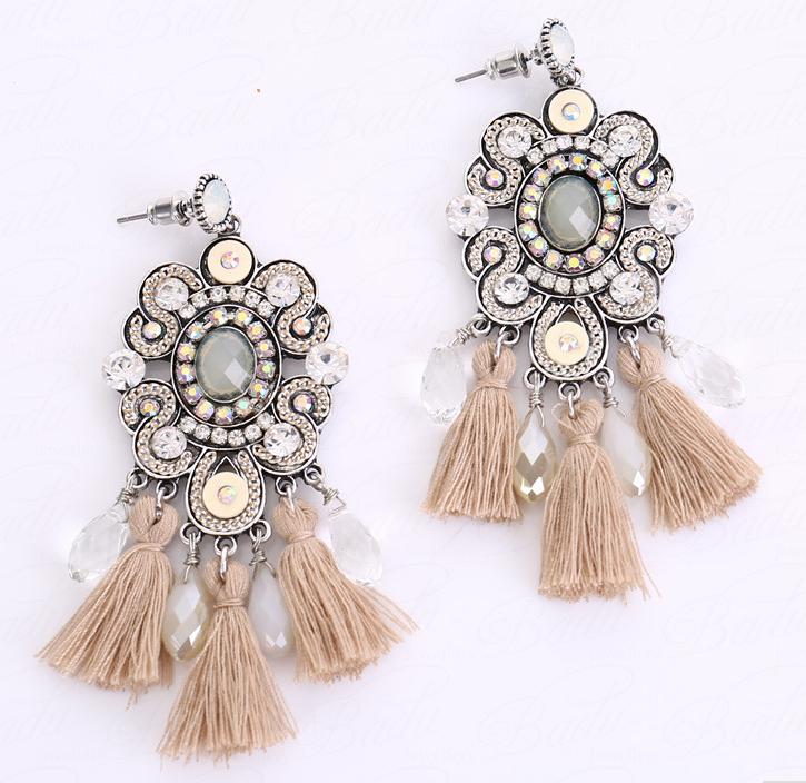 Neutral coloured crystal and tassel stud setting pendent earrings with a vintage feel.    