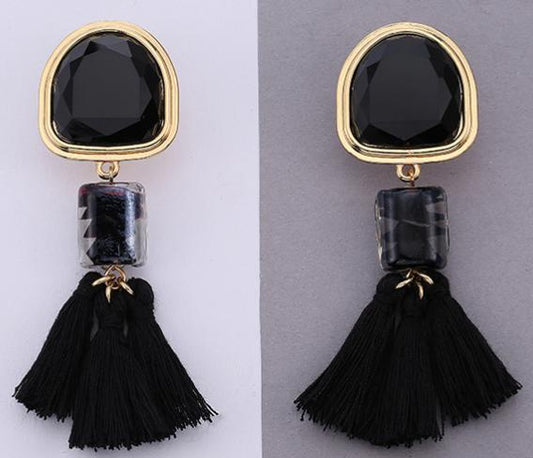 An understated alternative to simple tassels.  This jade coloured tassel and gem design is attached to a bigger similar coloured stone stud bordered in gold.  This colour looks great with red.