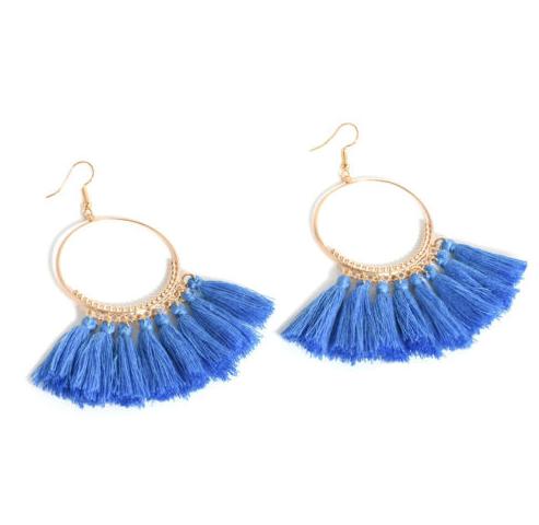 A bold colour cotton tassel earring on a very lightweight gold circular detailed frame. Versatile and easy wearing.
