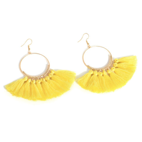 A bold colour cotton tassel earring on a very lightweight gold circular detailed frame. Versatile and easy wearing.