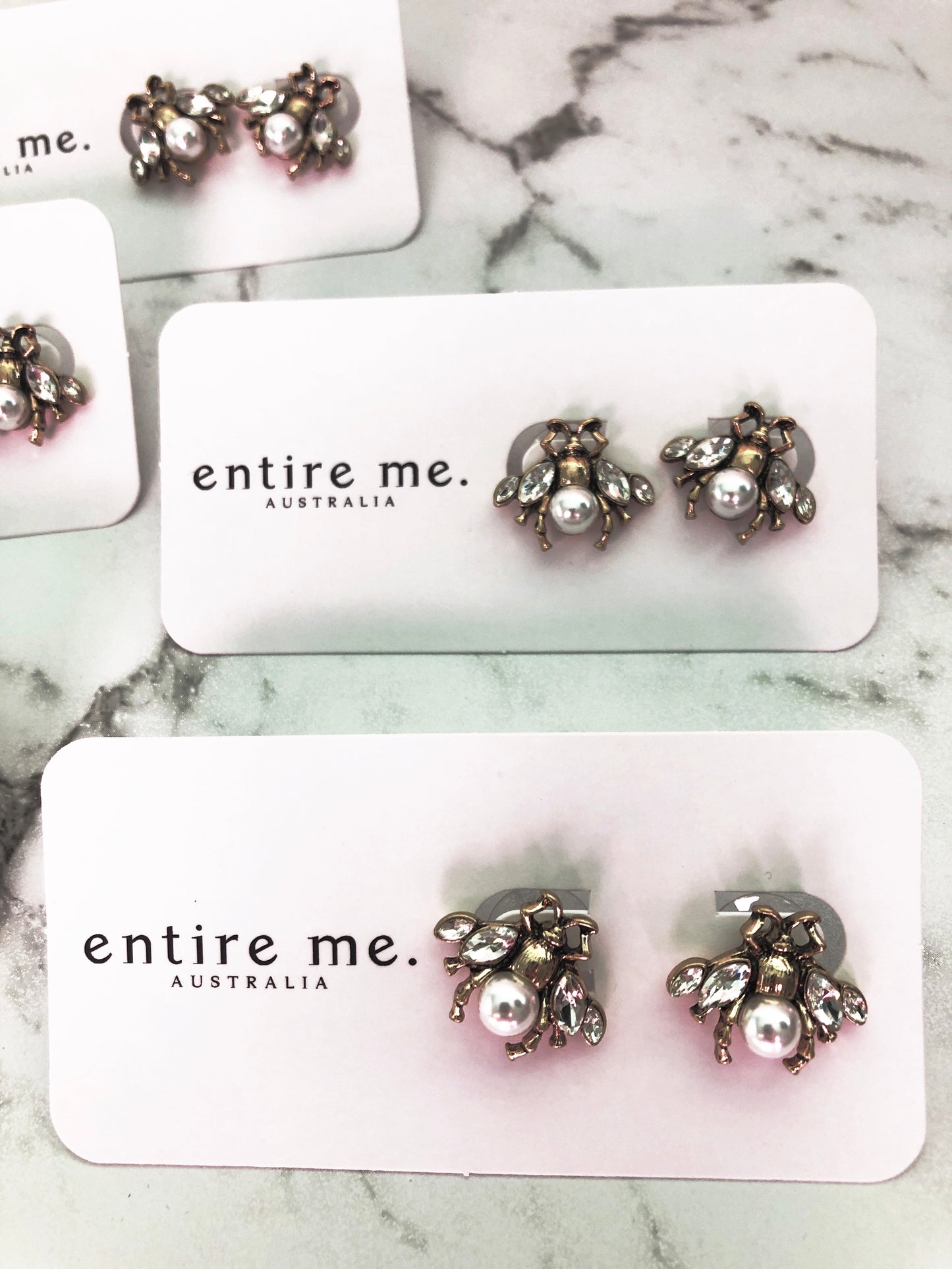 A small and intricate bug stud earring in vintage gold, faux pearl and clear crystals. The detailing on the little bug is just gorgeous. 