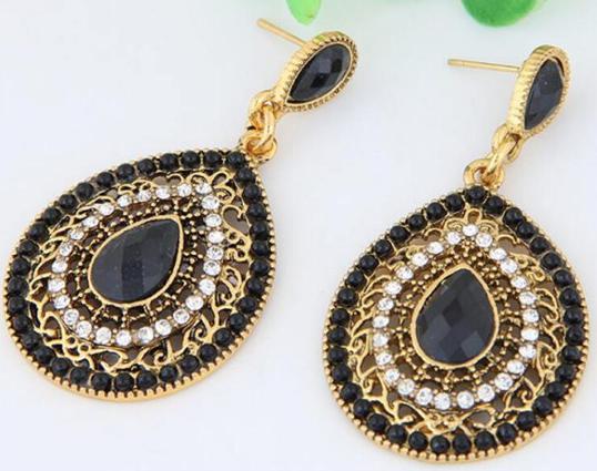 A pretty enamel and crystal teardrop statement earring on a lightweight alloy frame, hanging by a simple resin stud.