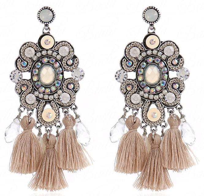 Neutral coloured crystal and tassel stud setting pendent earrings with a vintage feel.    