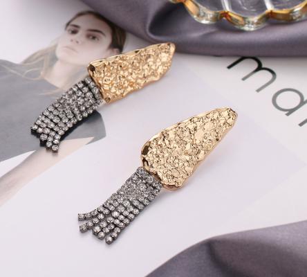 Gorgeous strings of crystals flowing from a hammered geo stud. Lightweight. Could be worn by lovers of gold and/or silver.   