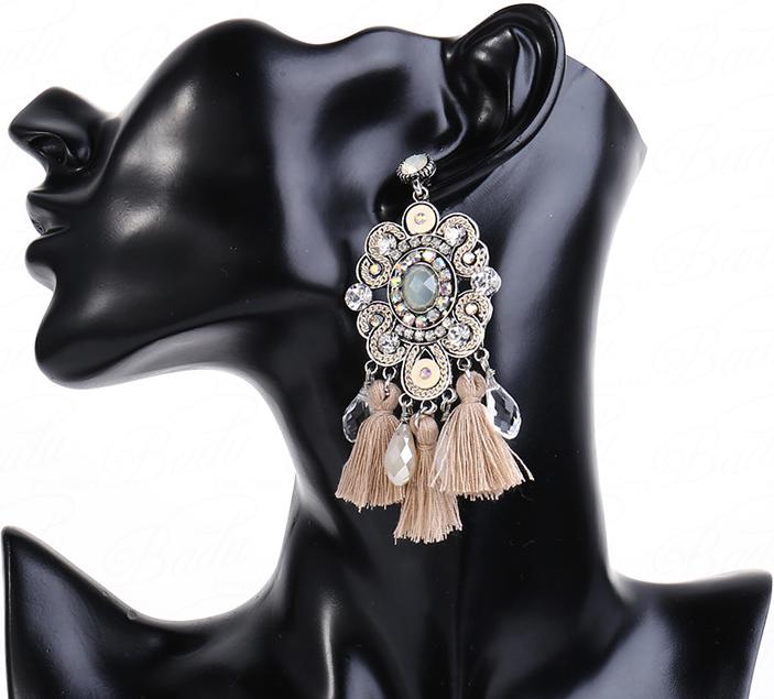 Neutral coloured crystal and tassel stud setting pendent earrings with a vintage feel.    
