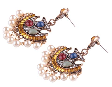An abstract fan shaped crystal and resin drop with faux pearl tassels.
