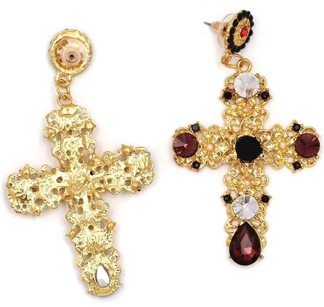 A gold coloured filigree cross with crystal embellishments and tiny faux pearl flower pieces.