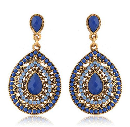 A pretty enamel and crystal teardrop statement earring on a lightweight alloy frame, hanging by a simple resin stud.