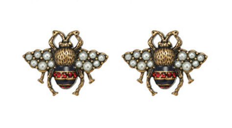 A small bug stud with a navy and red body, pearl encrusted wings and gold framing. The detailing on these little bugs is just gorgeous. 