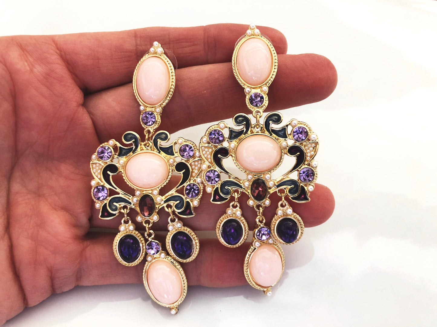 A vintage inspired glamour. Tones of pink, purple and gold with miniature pearl beading.