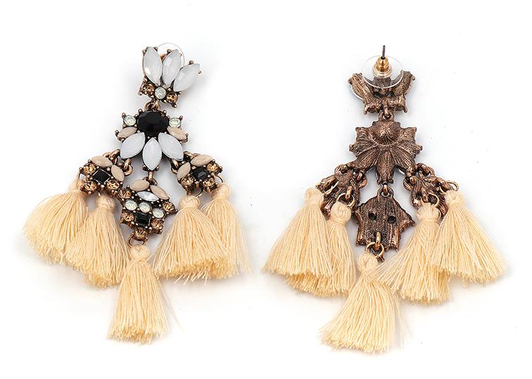 A medium sized flower petal pendant in tassels of three, complimented with matching coloured crystals and resin petals and a contrasting stone in the centre. 