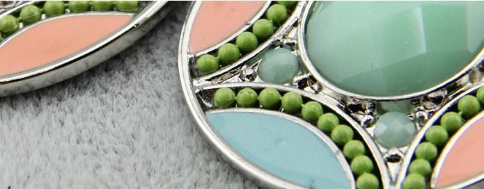 Beautifully coloured resin beaded statement earrings set out in a tiered teardrop design.  