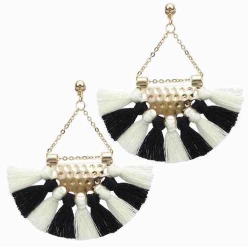 A simple and lightweight cotton tassel drop earring with pressed metal and chain detailing.  