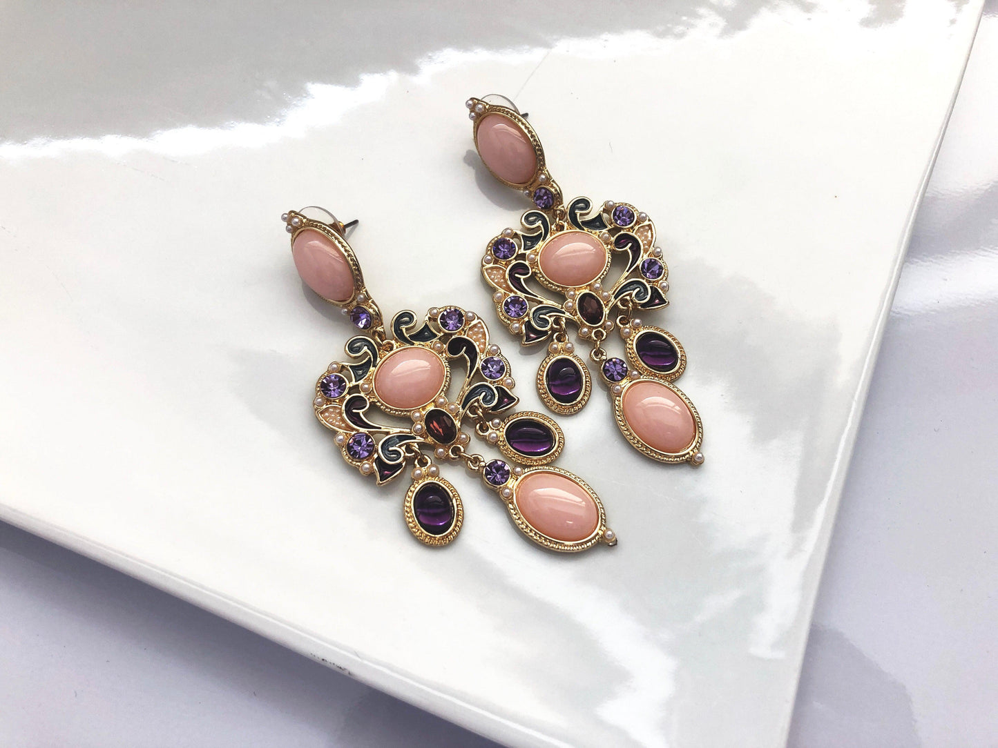 A vintage inspired glamour. Tones of pink, purple and gold with miniature pearl beading.