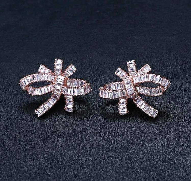 A beautiful encrusted oversized bow stud. Cubic zirconia. Zinc alloy, nickel free.