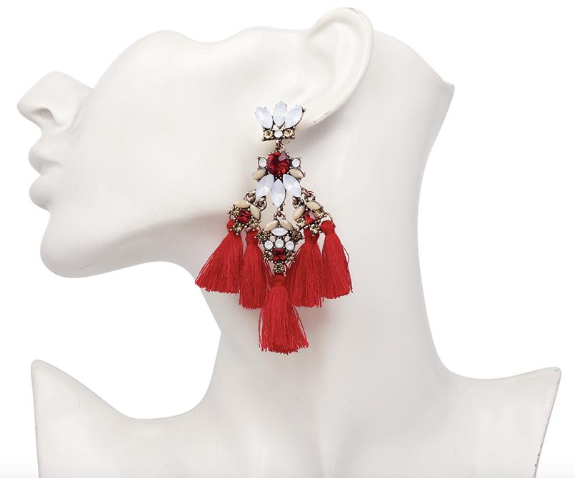 A medium sized flower petal pendant in tassels of three, complimented with matching coloured crystals and resin petals and a contrasting stone in the centre. 