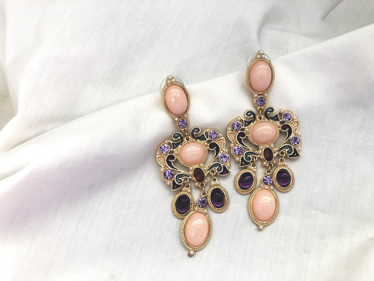 A vintage inspired glamour. Tones of pink, purple and gold with miniature pearl beading.