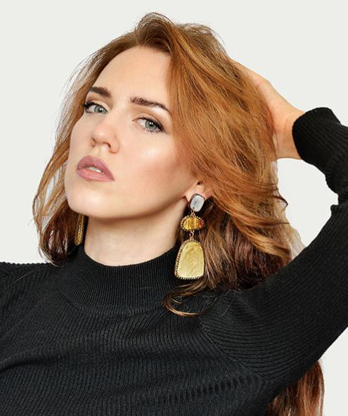 A three piece design made from marbled acrylic board in a golden coloured frame and bordered by tiny cubic zirconias.  Each earring is cut from a single piece of acrylic board, meaning each earring is unique and different.  Like you.