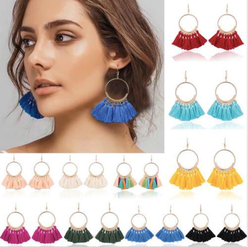 A bold colour cotton tassel earring on a very lightweight gold circular detailed frame. Versatile and easy wearing.