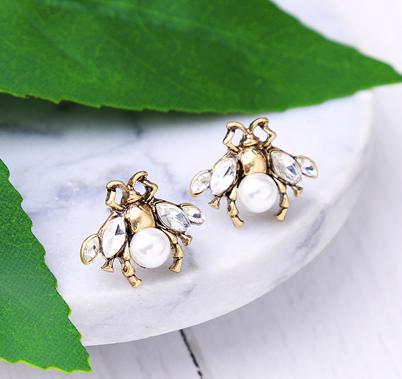 A small and intricate bug stud earring in vintage gold, faux pearl and clear crystals. The detailing on the little bug is just gorgeous. 