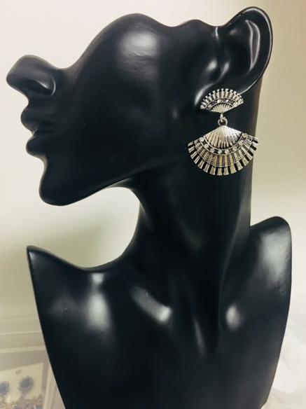 A silver metal and crystal double fan or open shell design. 