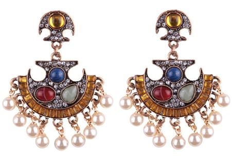 An abstract fan shaped crystal and resin drop with faux pearl tassels.