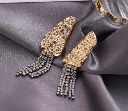 Gorgeous strings of crystals flowing from a hammered geo stud. Lightweight. Could be worn by lovers of gold and/or silver.   