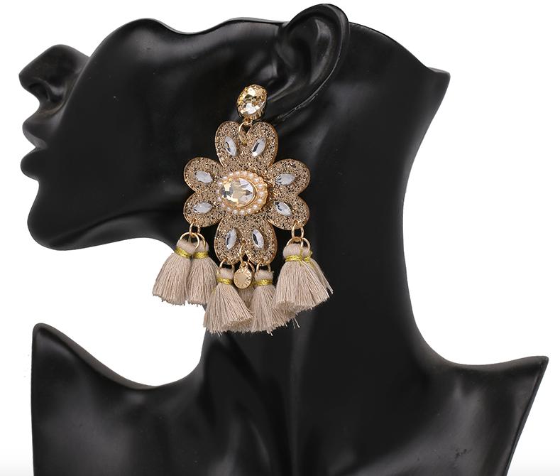 A tassel and crystal flower shape earring with tiny faux pearl beading. The main shape is glittered perspex, meaning the whole style is extremely lightweight. Can be worn all day long.