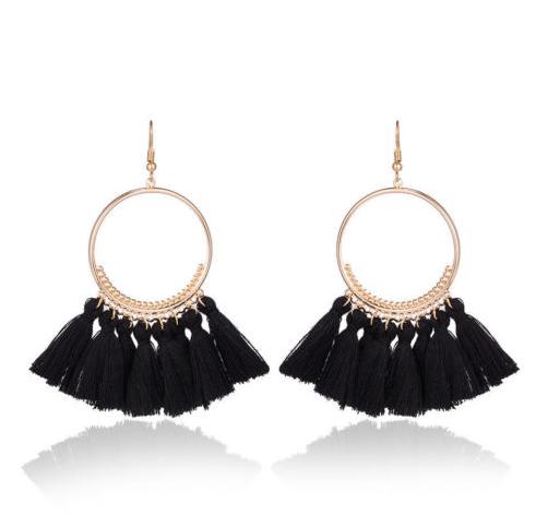 A bold colour cotton tassel earring on a very lightweight gold circular detailed frame. Versatile and easy wearing.