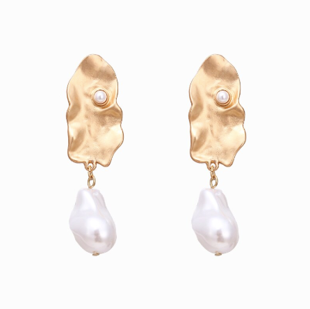 A generous sized pearl like drop attached to an abstract gold plate. 