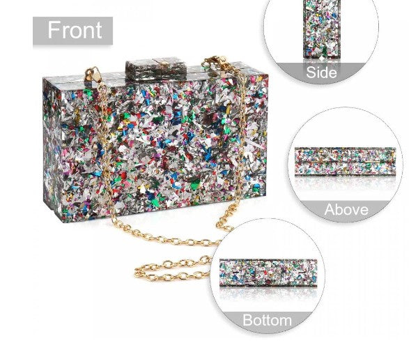 This eye-catching Geometric Acrylic Patterned Box Clutch is a must-have for your wardrobe. It comes in both Silver and Multicolor shades to capture attention. This box clutch is made with premium material for a look that is both beautiful and durable. Slim and elegant, it's ideal for special occasions and everyday use.