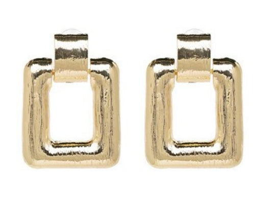 A simple large square drop earring, in either gold or silver, guaranteed to be spoken about.