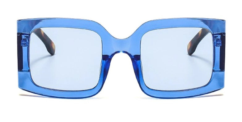 Have some fun with our blue leopard oversized square statement sunglasses. Lightweight and totally on trend!   Sunglasses are onesize and come with an Entire Me carry case.  Frame: Polycarbonate  Lense Optical: Photochromic, Anti-reflective, UV400