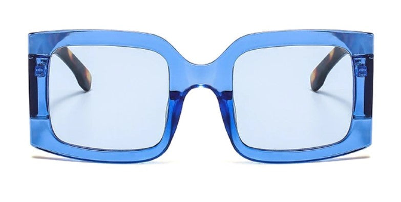 Have some fun with our blue leopard oversized square statement sunglasses. Lightweight and totally on trend!   Sunglasses are onesize and come with an Entire Me carry case.  Frame: Polycarbonate  Lense Optical: Photochromic, Anti-reflective, UV400