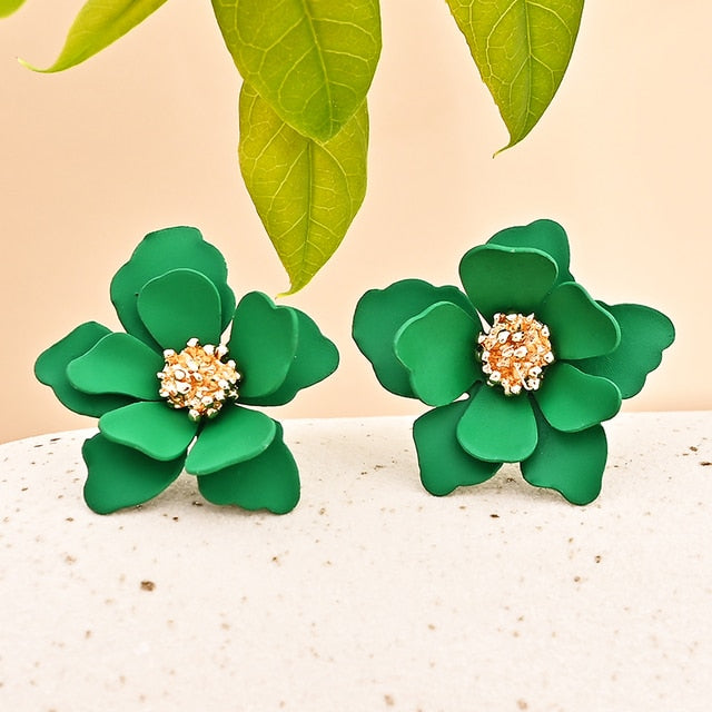 Carey is a delicate small flower cluster stud backed statement earring, available in either Black or Vibrant green, both with gold flower throats.  All earrings arrive beautifully packaged in our luxurious Entire Me pouch. 