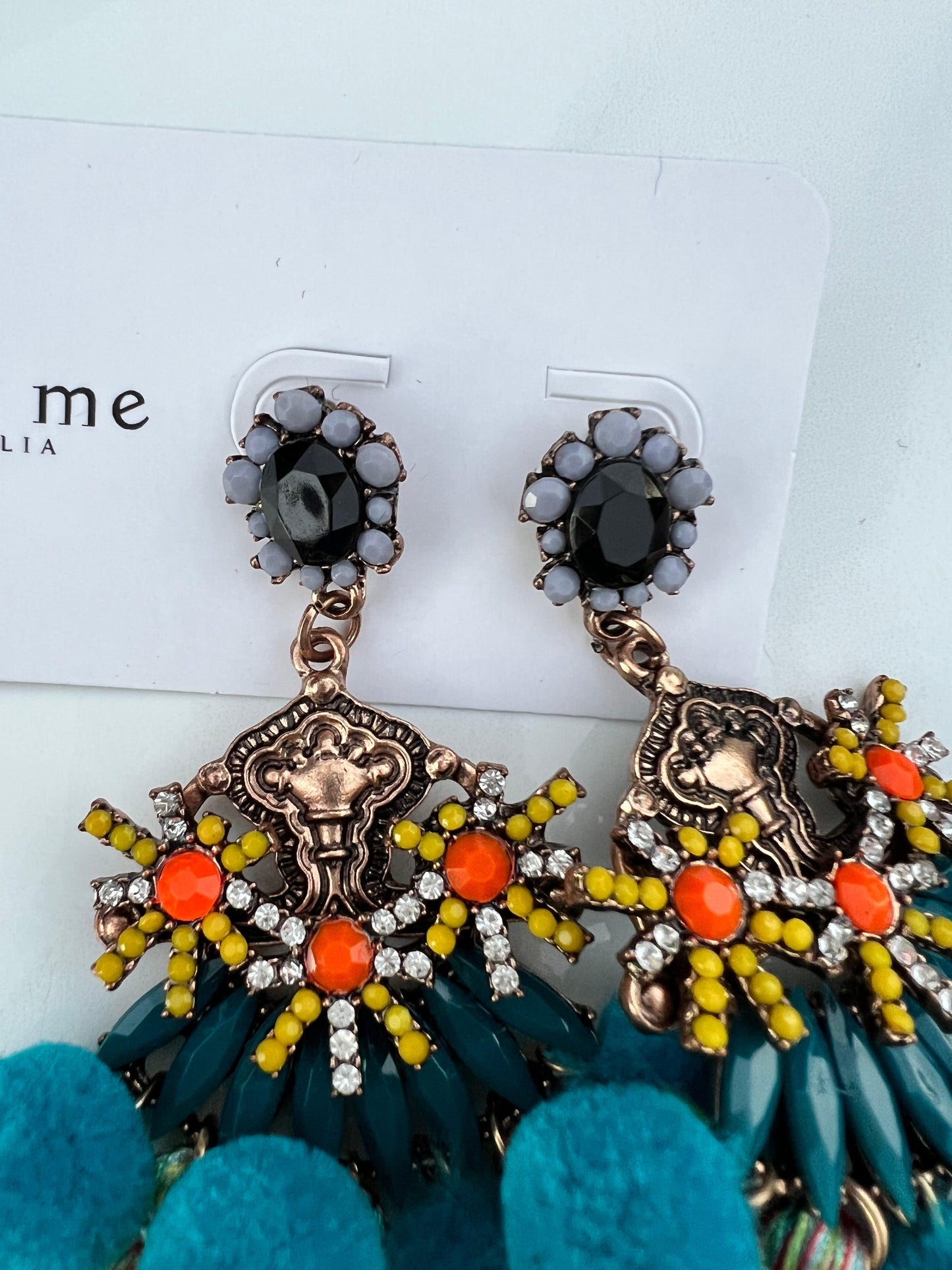 The perfect earring for a fun occasion, Florence has all the feels.   Pom Poms, Crystals, Beads & Tassels in a detailed setting.   Care is required to maintain tassel shape, this earring is on the heavy side so best worn for shorter periods, unless you are seasoned to the heavier pieces!  